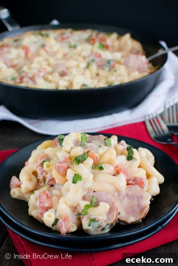 Tomato Basil Sausage Skillet - cheesy pasta dinner that can be ready in under 30 minutes. Great dinner recipe for busy nights. Tomato Basil Sausage Skillet - cheesy pasta dinner that can be ready in under 30 minutes. Great dinner recipe for busy nights.