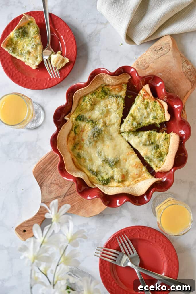 broccoli cheddar quiche with tortilla crust laid out in a brunch spread
