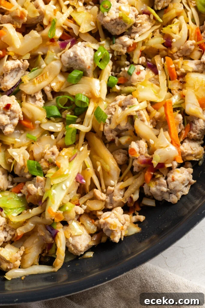 hyper closeup shot of turkey egg roll bowl mixture in the skillet.