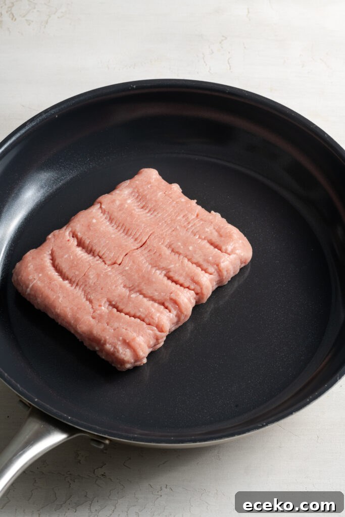 ground turkey cooking in a skillet.