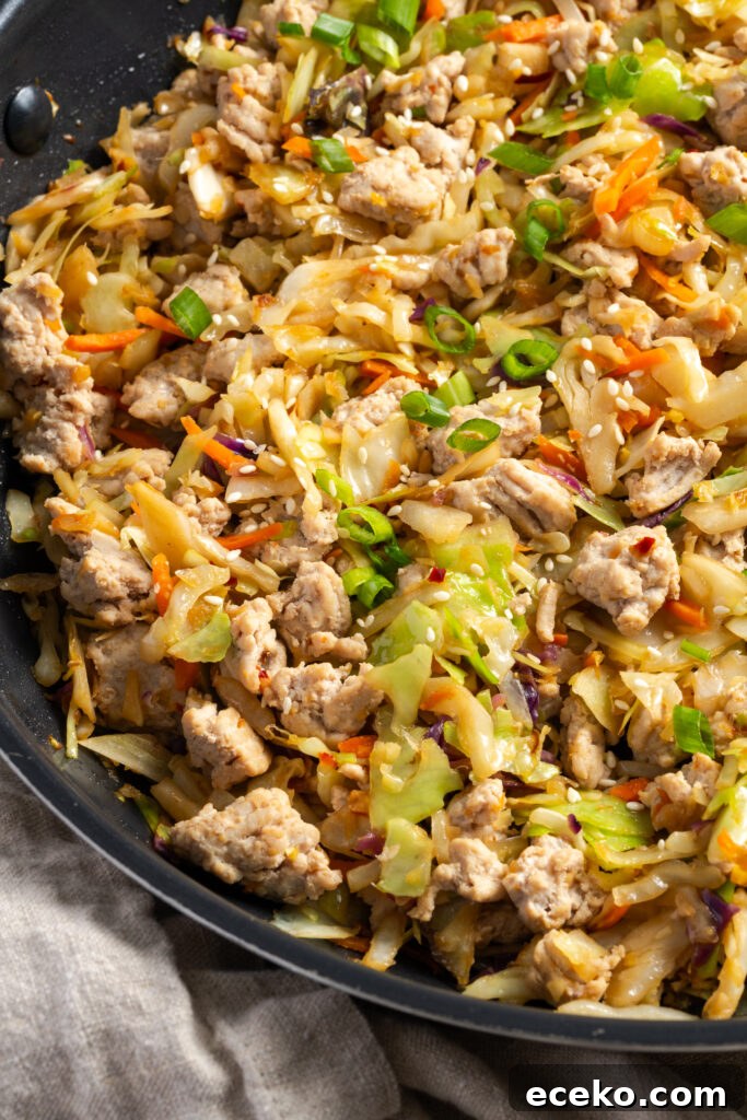 closeup shot of easy turkey egg roll in a bowl in a black skillet.