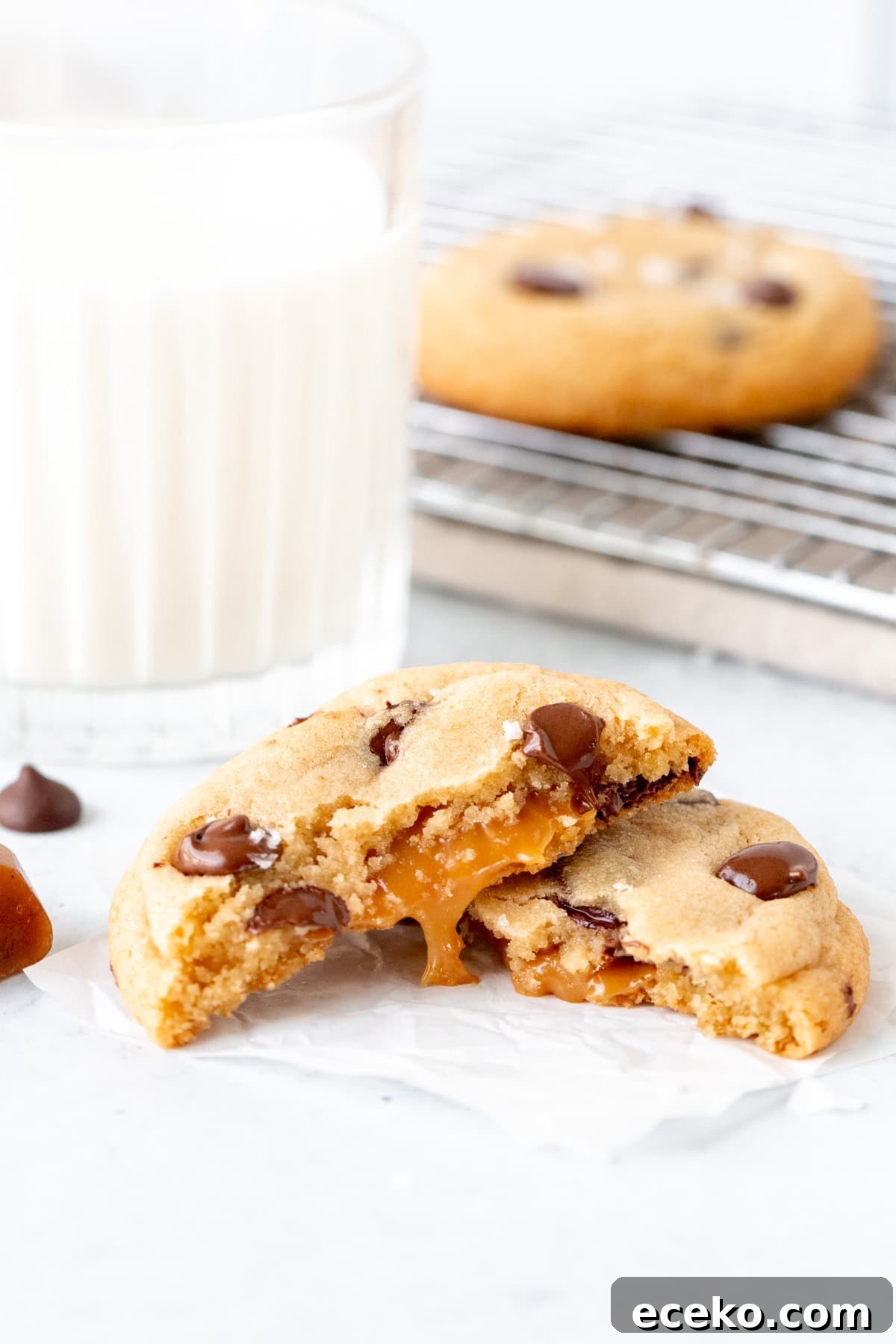 Chewy Caramel and Chocolate Chip Cookies Recipe 3 Caramel chocolate chip cookie, broken in half with glass of milk