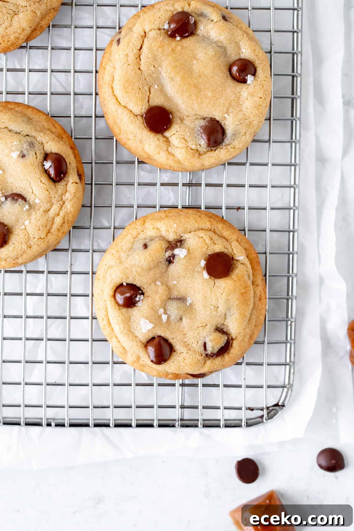 Chewy Caramel and Chocolate Chip Cookies Recipe 6 Chocolate chip cookies stuffed with caramel on a cooling rack