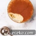 Keto Tiramisu Cottage Cheese Cookie Dough with one bite taken out with cocoa powder duster