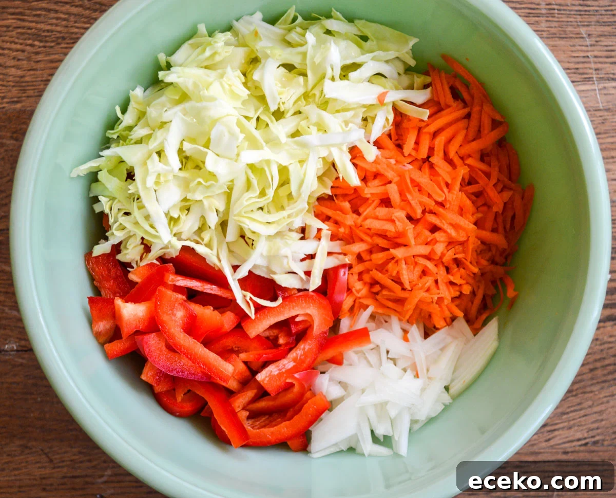 cut and shredded veggies in a green bowl