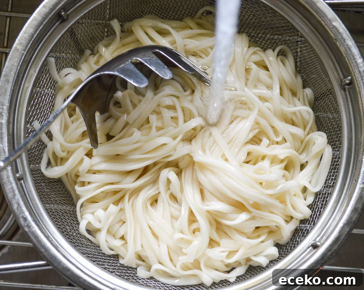rinsing cooked noodles with cold water