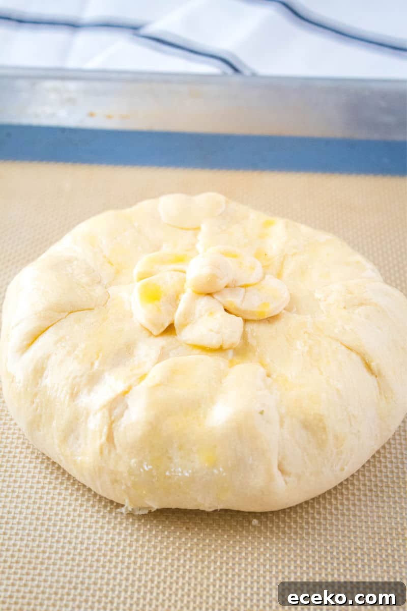brie wrapped in crescent roll dough and brushed with a beaten egg