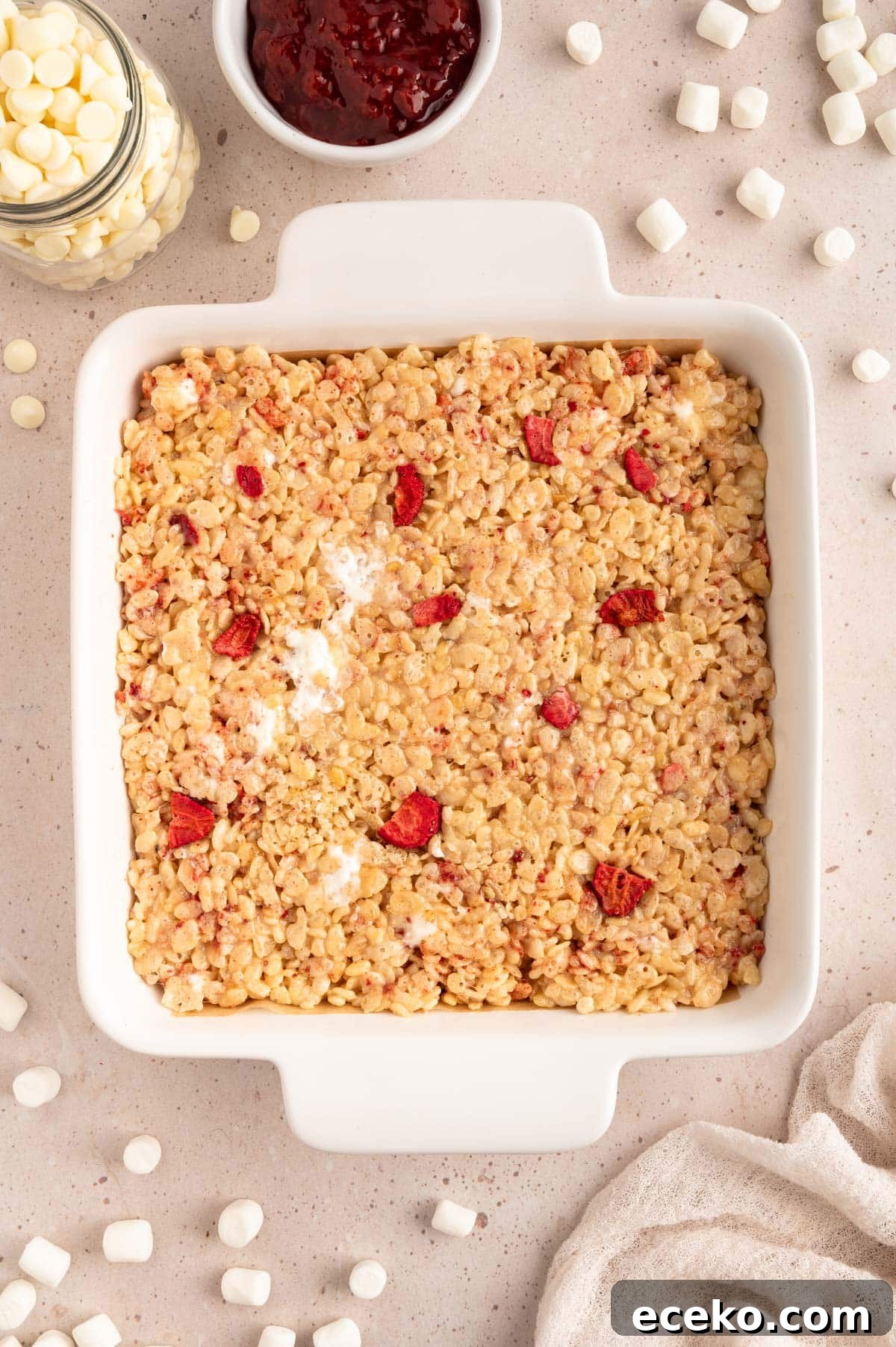Strawberry Rice Krispie Treats Recipe for Fresh, Fruity Squares 7 strawberry rice krispy treats in a white square baking dish
