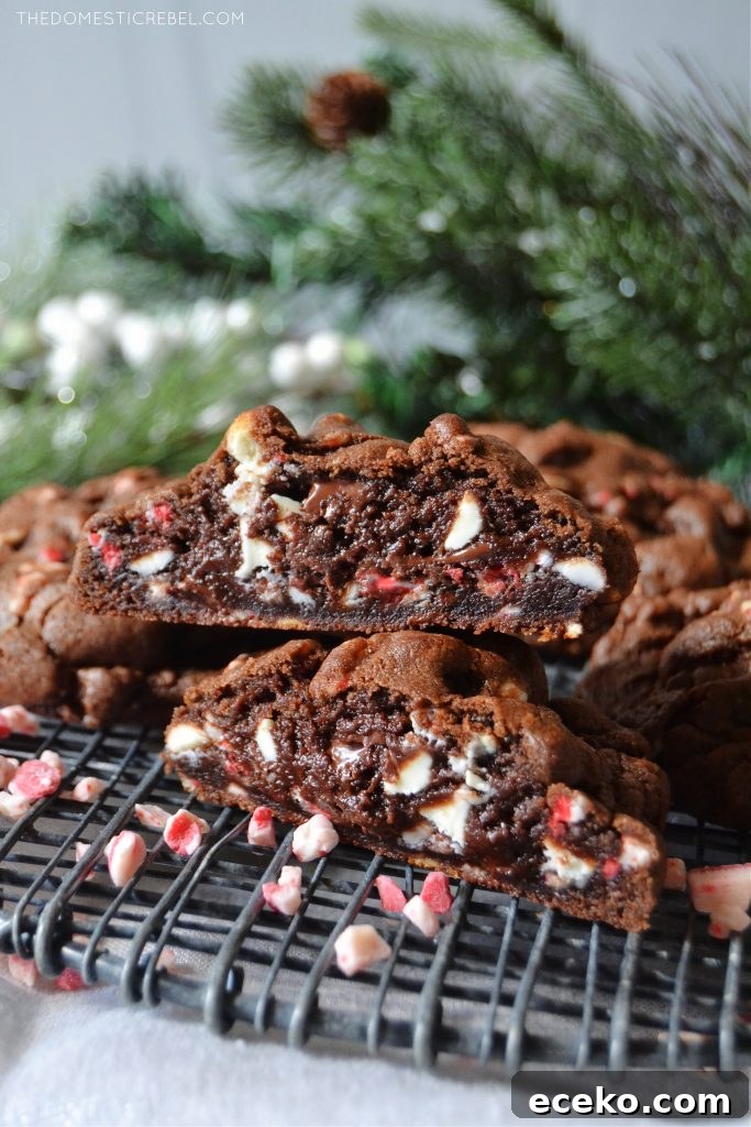 Chocolate Peppermint Cookies Inspired by Levain Bakery 3 a double stack of chocolate peppermint cookies cut open to show texture on a black wire rack