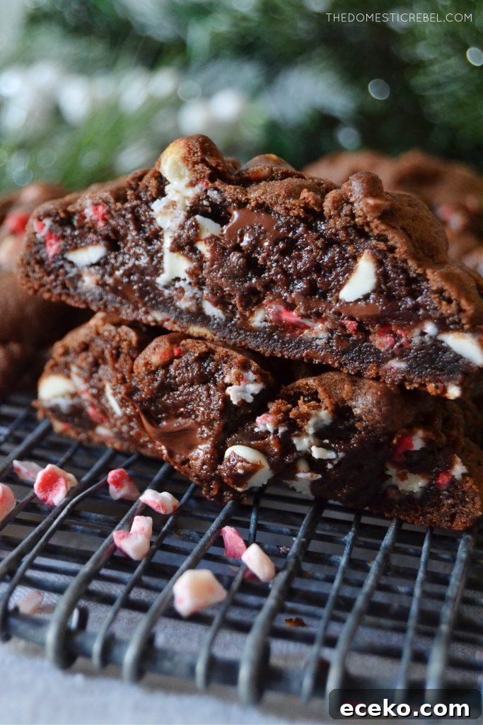 Chocolate Peppermint Cookies Inspired by Levain Bakery 4 a closeup stack of chocolate peppermint cookies cut open to show texture
