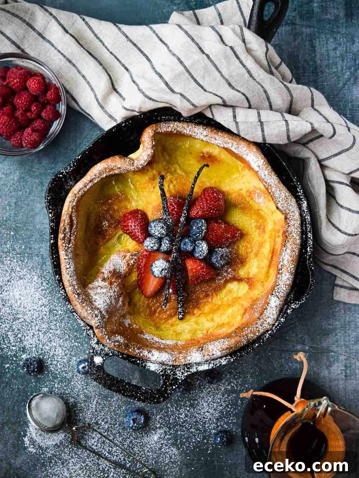Vanilla Dutch Baby Pancake Recipe: Light Oven-Baked Treat 2 Overhead picture of a vanilla Dutch baby with fruit in the middle.