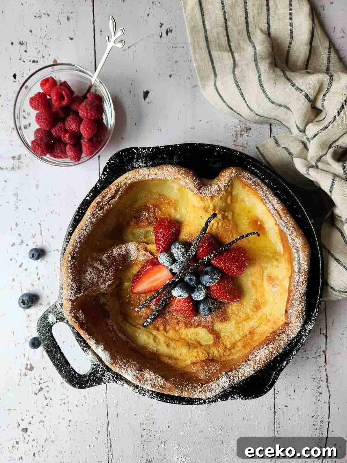 Vanilla Dutch Baby Pancake Recipe: Light Oven-Baked Treat 7 Overhead of fruit toppings in the center of a Dutch baby.