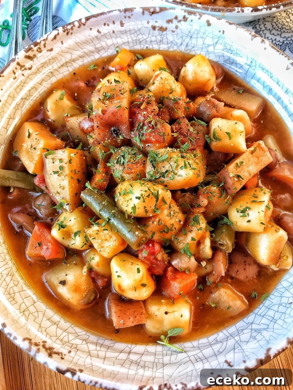 Slow-Cooker Minestrone Soup Recipe for Hearty Weeknight Meals 10 An overhead shot of the finished minestrone soup with potato dumplings in a bowl