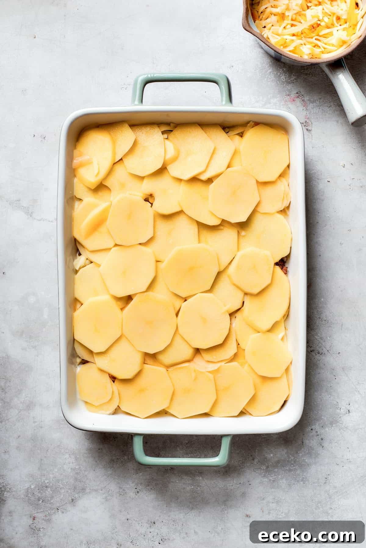 Sliced potatoes are added.