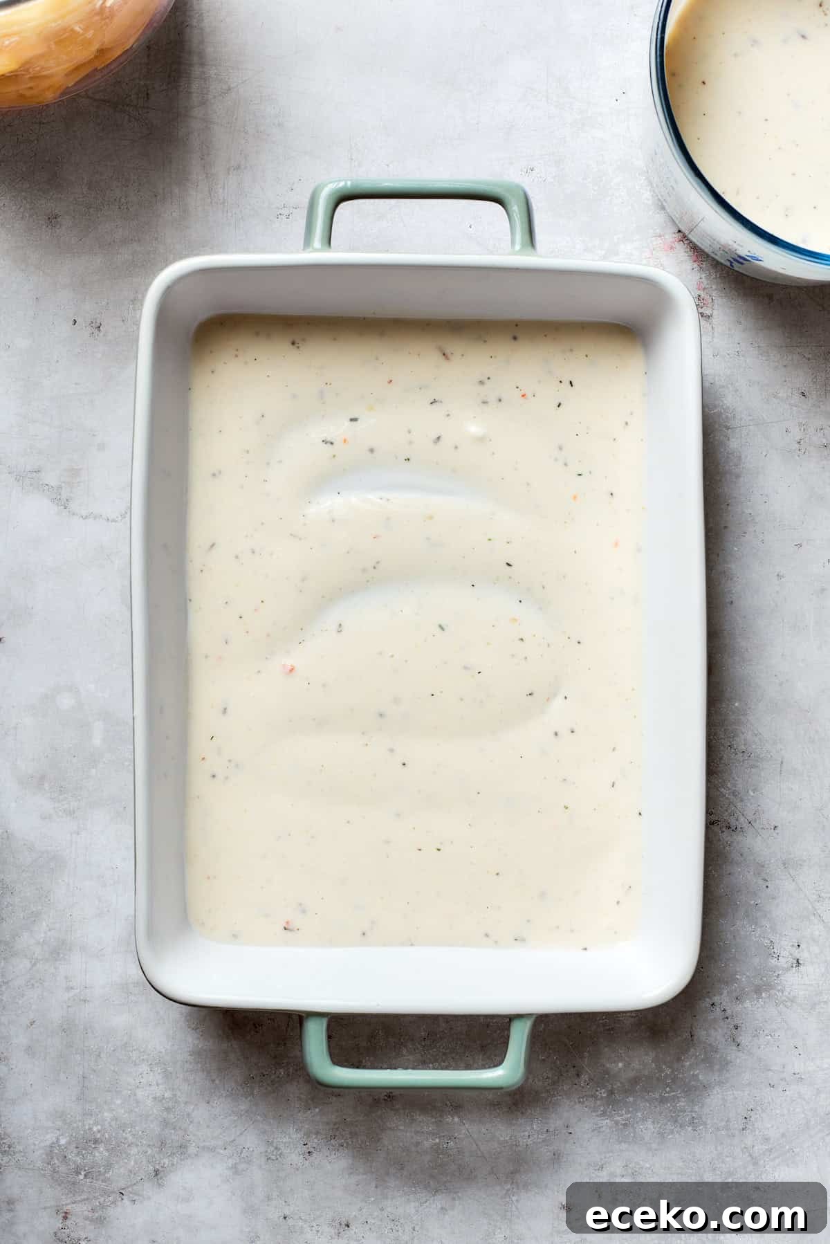 Mushroom soup is added to the bottom of the pan.