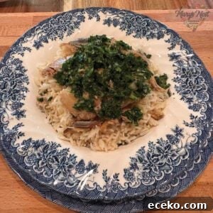 Kippers with rice and parsley mixture in bowl.