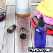 homemade cloth diaper solution in a bottle surrounded by ingredients