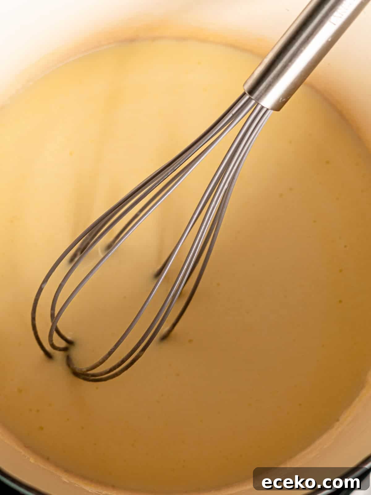 Roux with a whisk in a large pot.