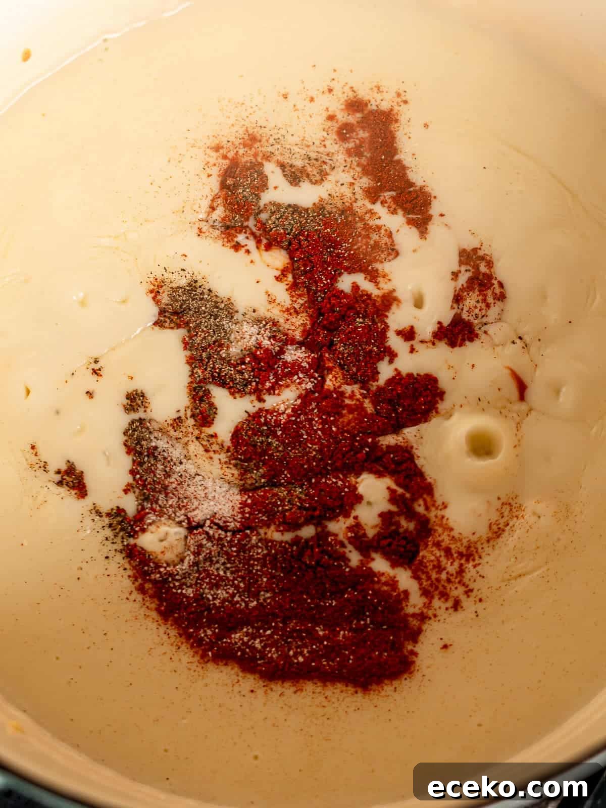 Spices in a cheese sauce.