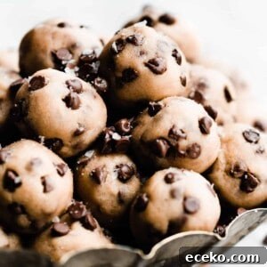 No-Bake Edible Cookie Dough Bites Recipe for Parties 16 No bake cookie dough bites piled in a metal tray.