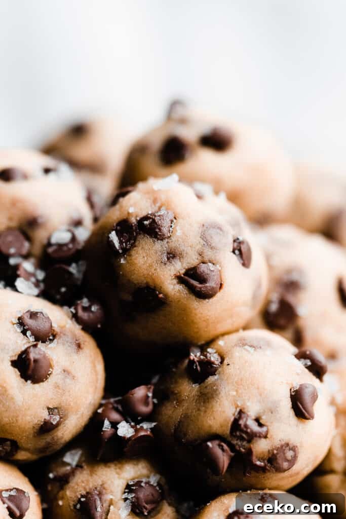 No-Bake Edible Cookie Dough Bites Recipe for Parties 4 A close-up of no bake cookie dough balls in a vintage tray.