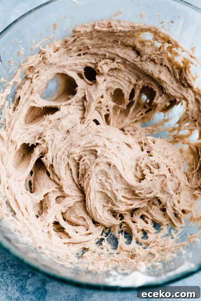 No-Bake Edible Cookie Dough Bites Recipe for Parties 6 A bowl of creamed butter, sugar, and cream cheese.