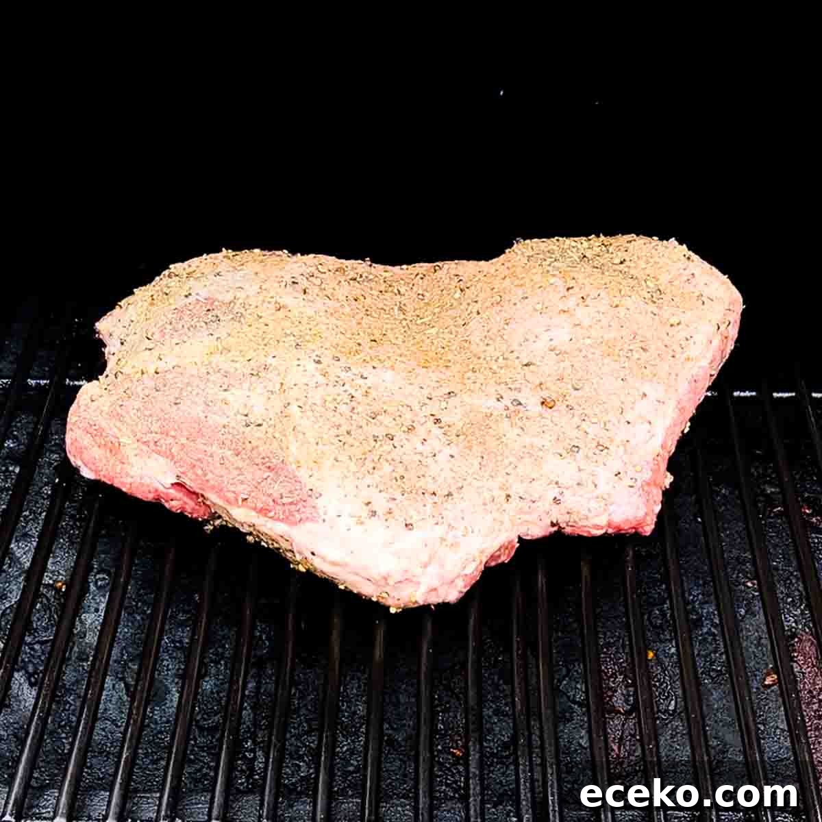 Boneless Smoked Leg of Lamb on a Pellet Grill — Tender Recipe 6 The prepared leg of lamb on the grill grates of a pellet smoker.