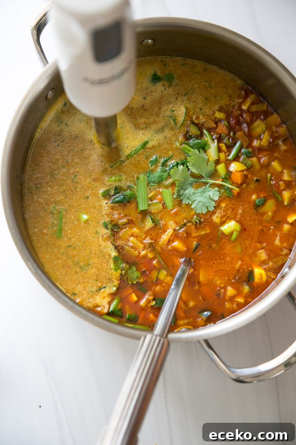 Summer Detox Soup in a pot with immersion blender