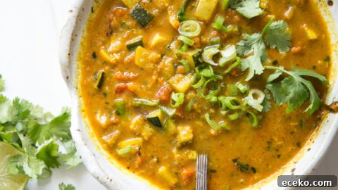 Summer Detox Soup in a bow with zucchini, summer squash and peppers