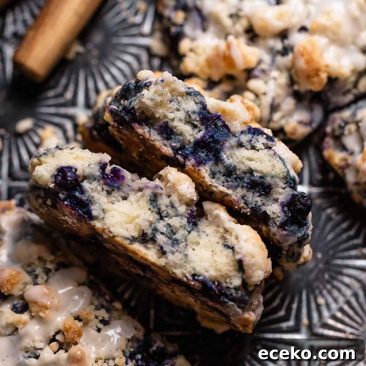 A blueberry scone cut in half to show the moist and tender texture.