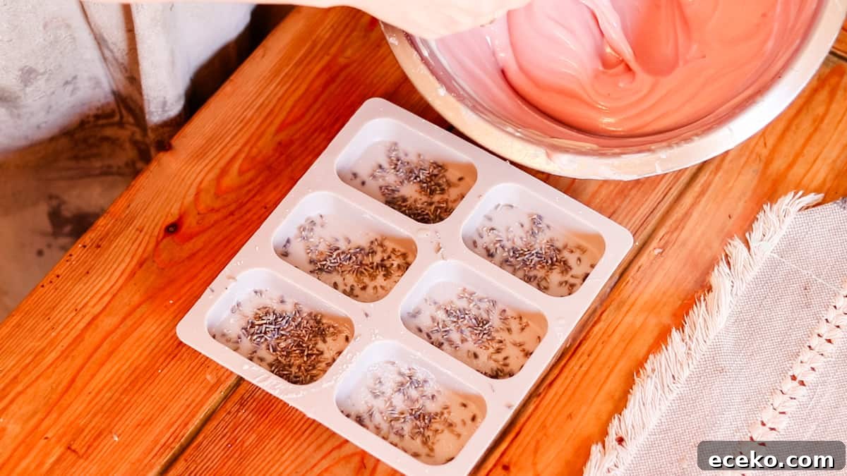 A silicone soap mold with lavender petals sprinkled into the bottom of the mold.