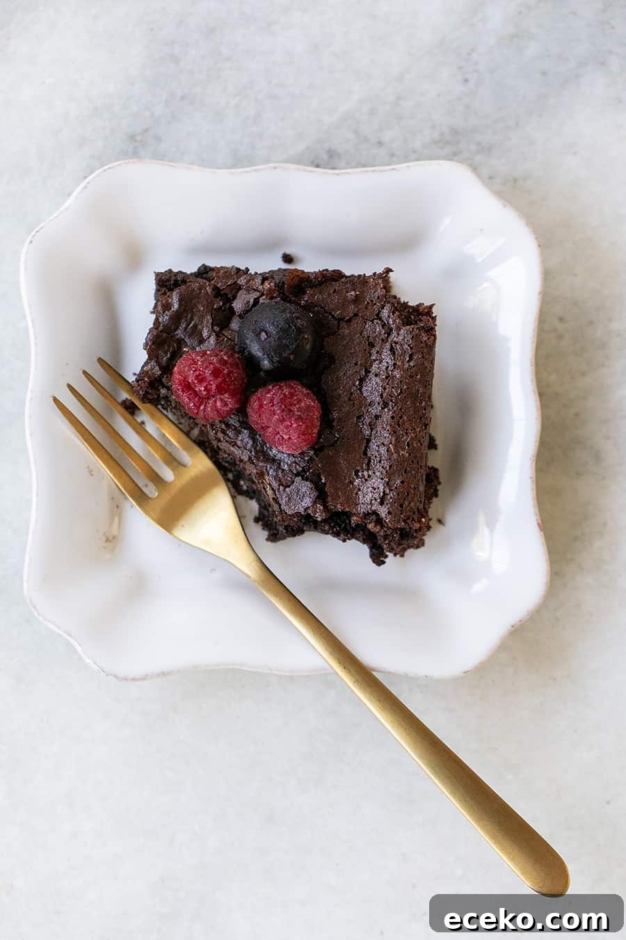 Fudgy Gluten-Free Brownies with Rich Chocolate Flavor 5 Chocolate brownie made with almond flour on a plate.