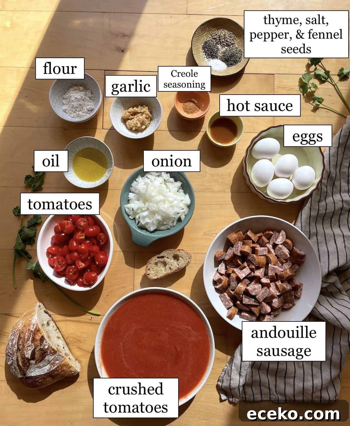 Creole-Style Tomato Shakshuka 3 The ingredients in creole tomato shakshuka, laid out and labeled.