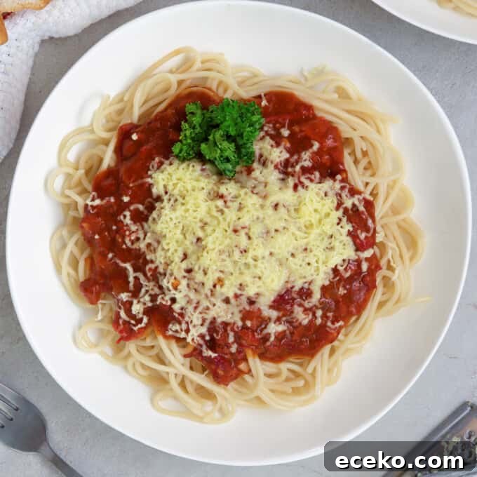 filipino-style spaghetti with corned beef on a white plate