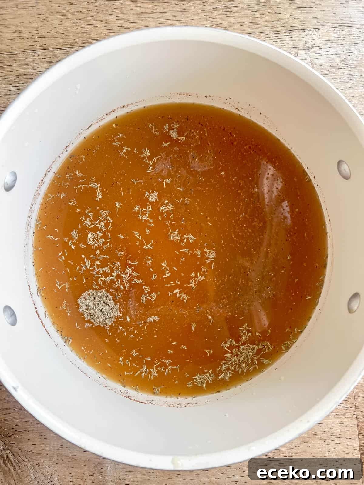 Bone broth in a soup pan.