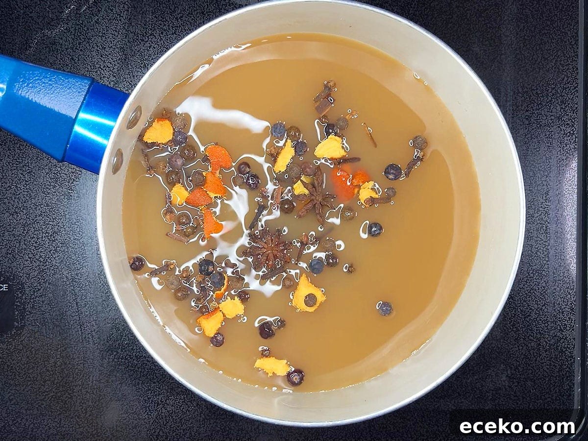 Two tablespoons of mulling spices added to four cups of apple cider in a medium saucepan.