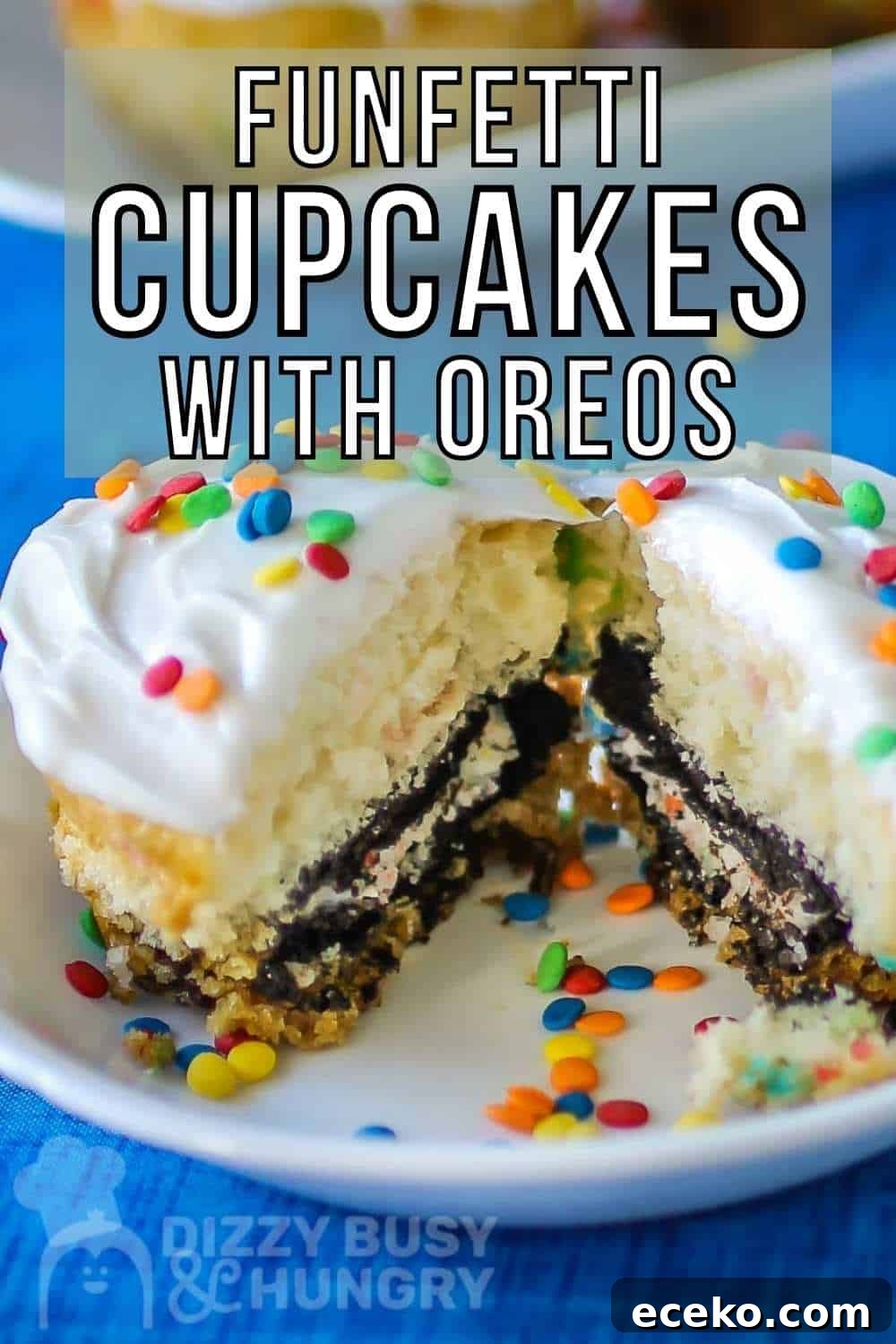 Funfetti Oreo Cupcakes: Simple, Colorful Party Treat 2 Side close up shot of a cupcake split in half on a small white plate with more cupcakes in the background all on a blue tablecloth.