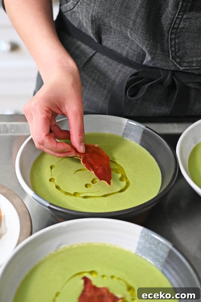 Adding crispy prosciutto chips to bowls of pea soup drizzled with extra virgin olive oil