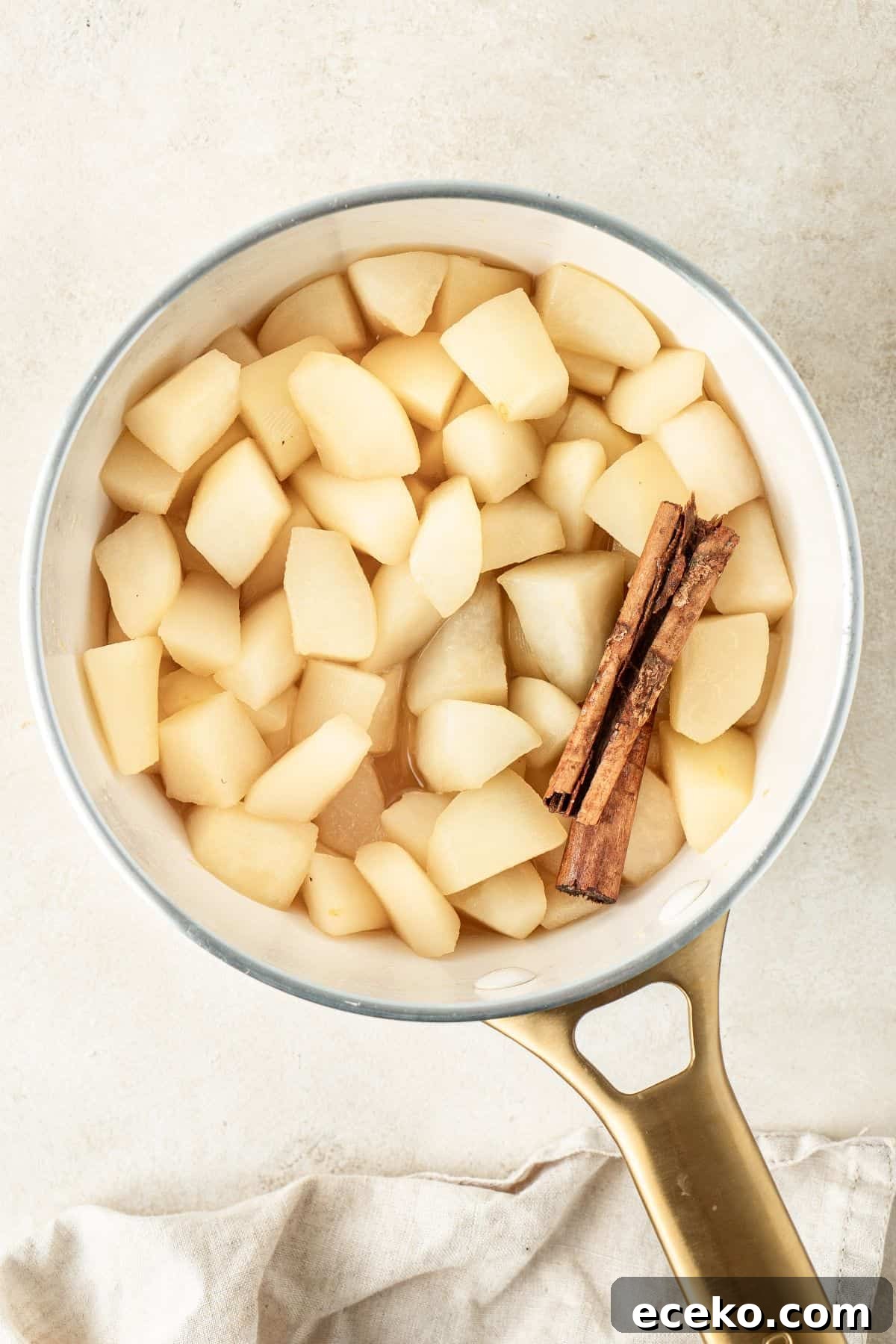 The Stewed Pears in a saucepan, cooked and ready for serving.