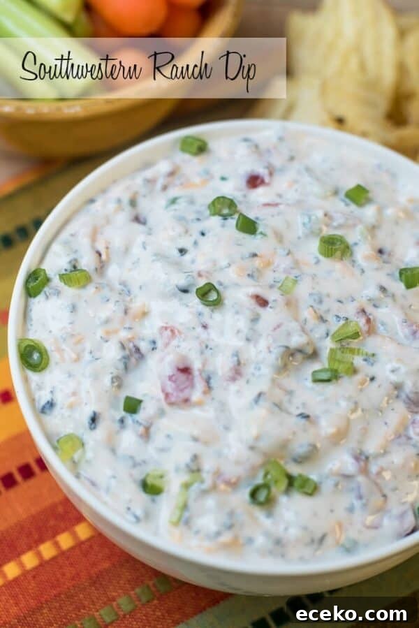 A bowl of southwestern ranch dip topped with sliced green onions.