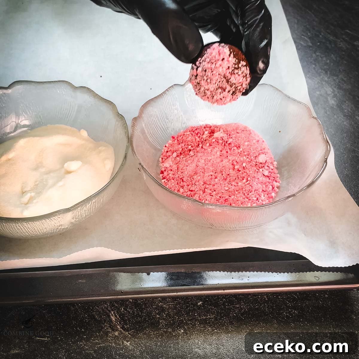 Chocolate Peppermint Crinkle Cookies Recipe for the Holidays 12 Hand with black gloves holding dough ball over a bowl filled with crushed candy canes.
