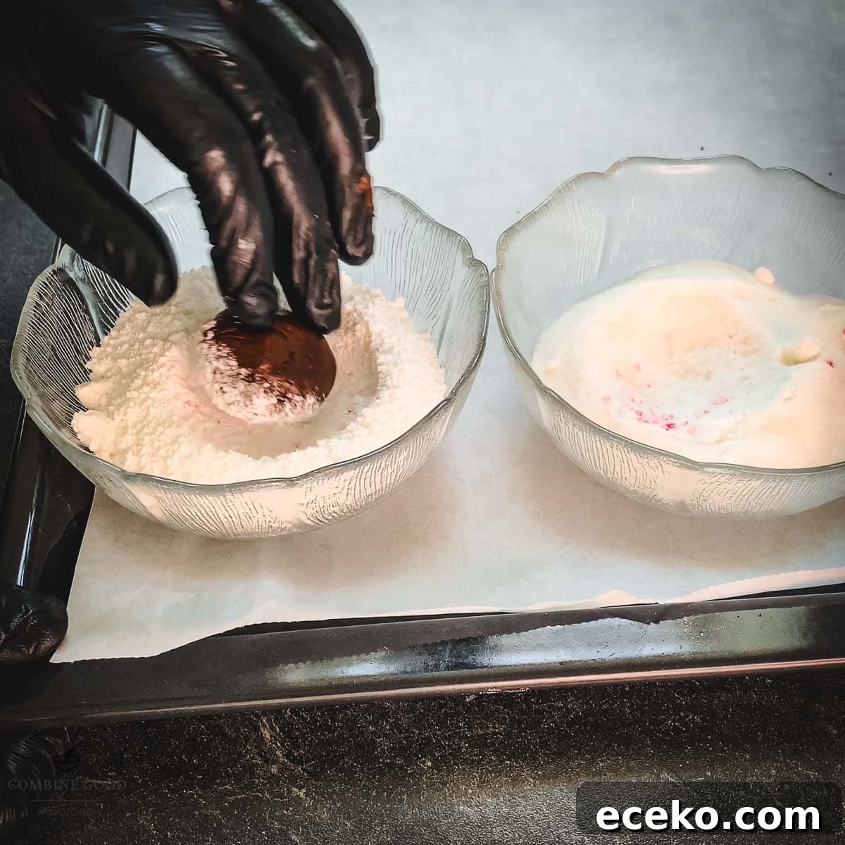 Chocolate Peppermint Crinkle Cookies Recipe for the Holidays 15 Hand with black gloves holding dough ball over a bowl filled with powdered sugar.