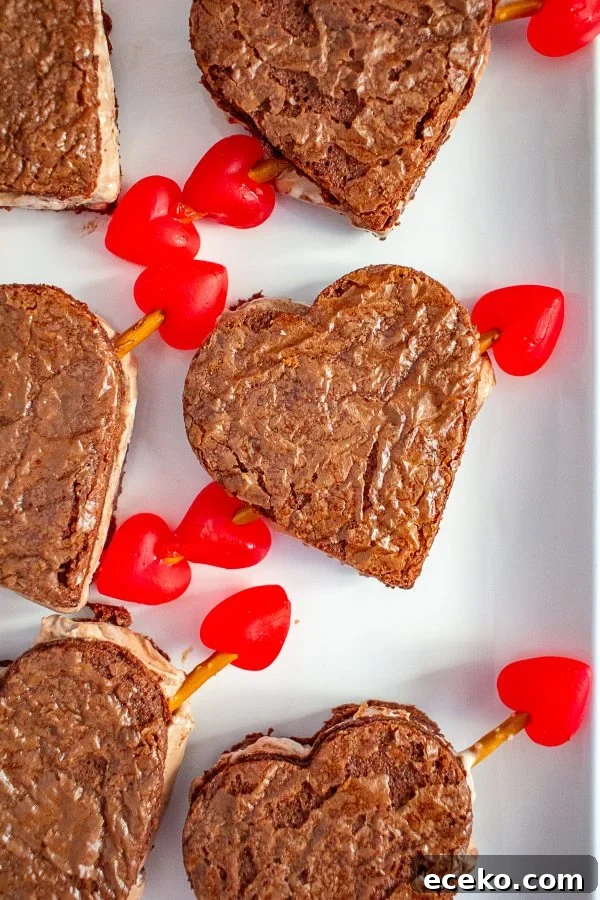 Valentine’s Day Ice Cream Sandwiches | These ice cream sandwiches made with Hudsonville Ice Cream and boxed brownie mix are a perfect Valentine’s Day Dessert. Valentine’s Day Ice Cream Sandwiches | These ice cream sandwiches made with Hudsonville Ice Cream and boxed brownie mix are a perfect Valentine’s Day Dessert.