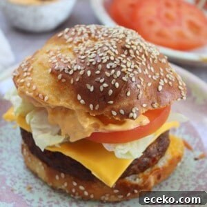 A gluten free hamburger with cheese.
