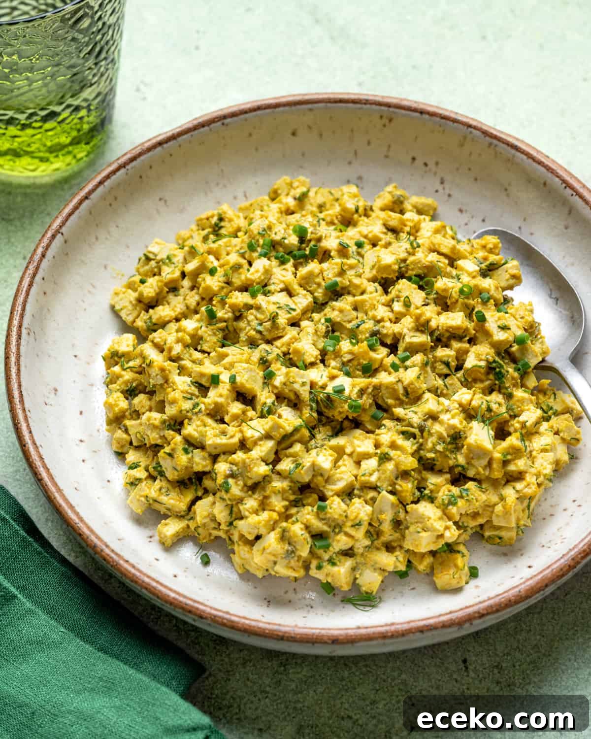 Vegan egg salad in a large white bowl.
