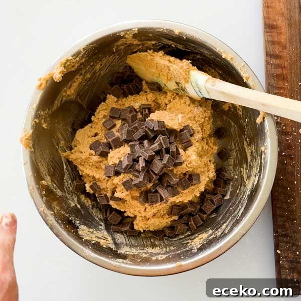 Pumpkin Cottage Cheese Scones with Chocolate Chunks 12 Stirring the chocolate chunks into the scone dough.