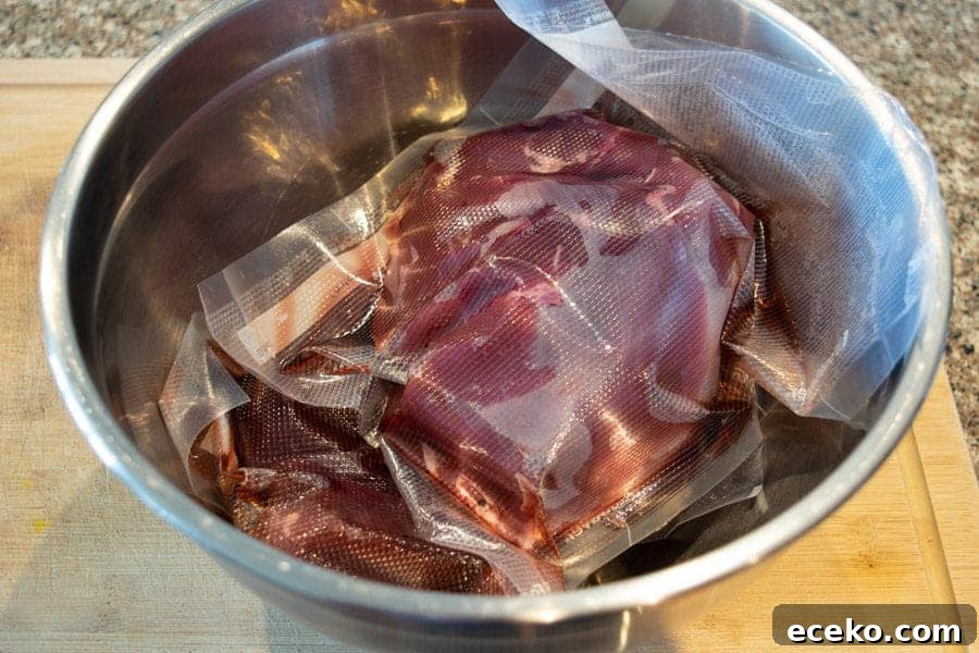 Rosemary-Pear Venison Jerky Recipe for Flavorful Snacks 3 Thawed freezer packed venison in bowl