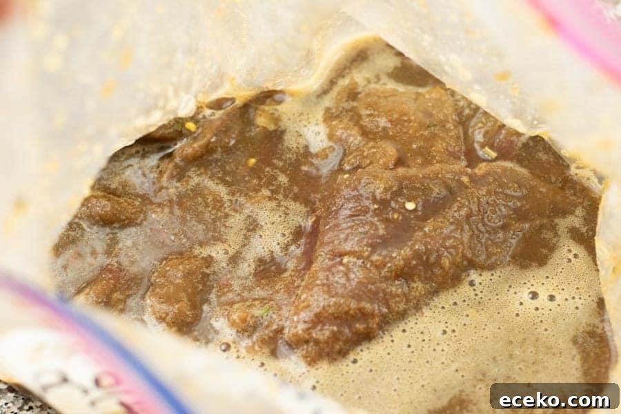 Rosemary-Pear Venison Jerky Recipe for Flavorful Snacks 8 deer jerky marinating in ziplock bag