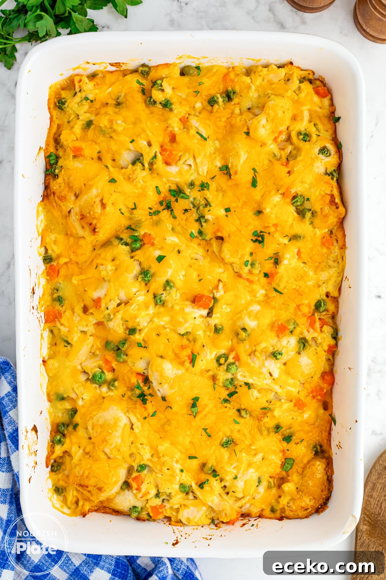 Chicken Pot Pie Bubble-Up Casserole Recipe for Cozy Dinners 3 Overhead shot of Chicken Pot Pie Bubble Up Casserole in a white ceramic casserole dish