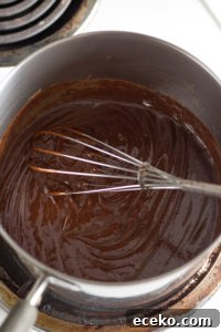 No-Bake Chocolate Peanut Butter Oatmeal Cookies – Gluten Free 5 chocolate mixture in a pan with a whisk